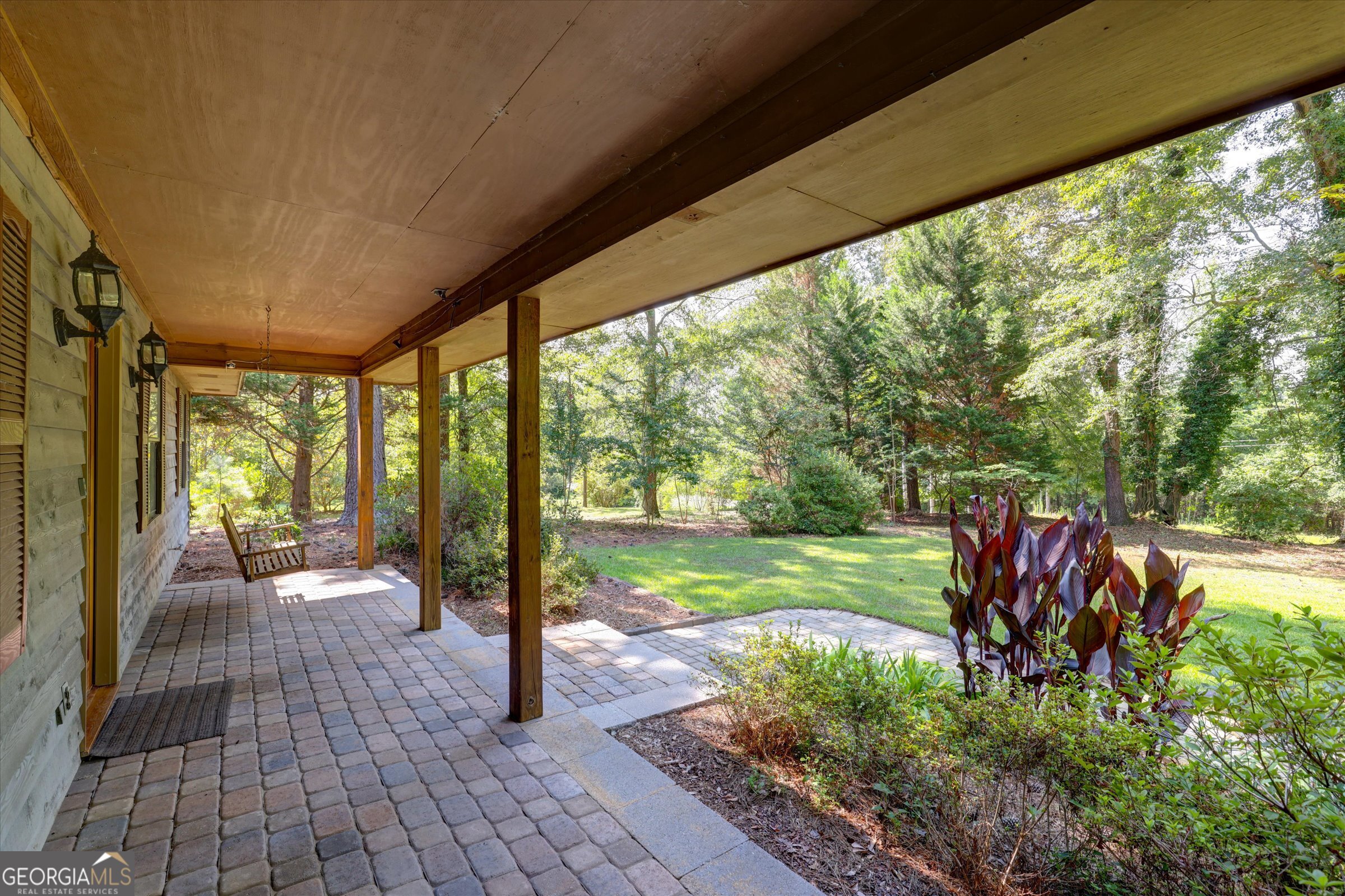 424 Hampton Road Hampton, GA 30228 - Photo 12 of 96 a view of a porch with chairs and backyard