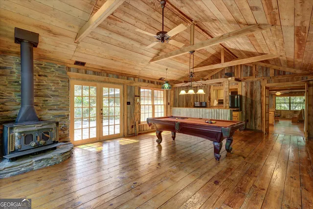 a view of a porch with chairs and backyard