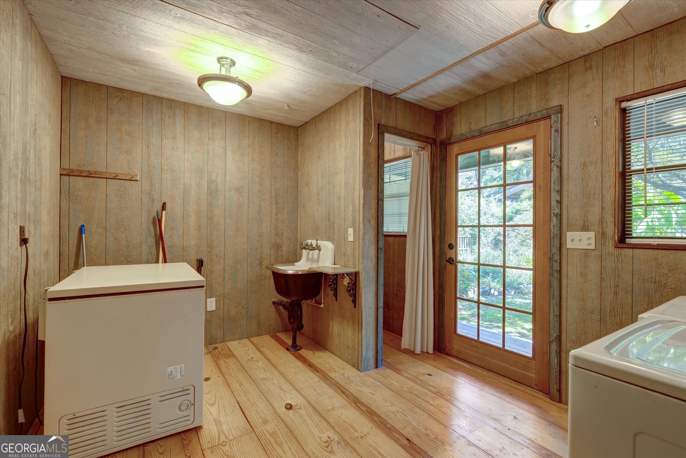 424 Hampton Road Hampton, GA 30228 - Photo 46 of 96 a view of a bathroom with sink and wooden floor