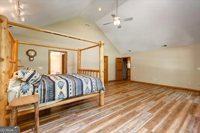 an aerial view of a houses with a lake view