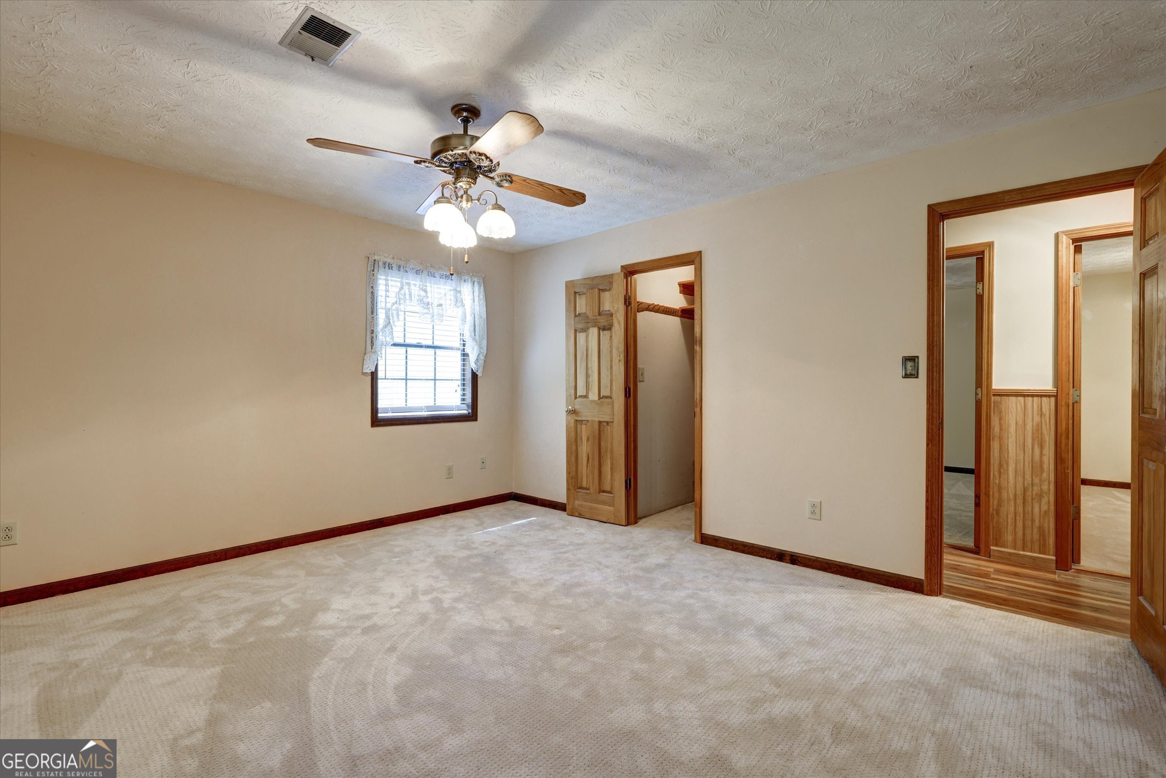 424 Hampton Road Hampton, GA 30228 - Photo 64 of 96 an empty room with windows and fan