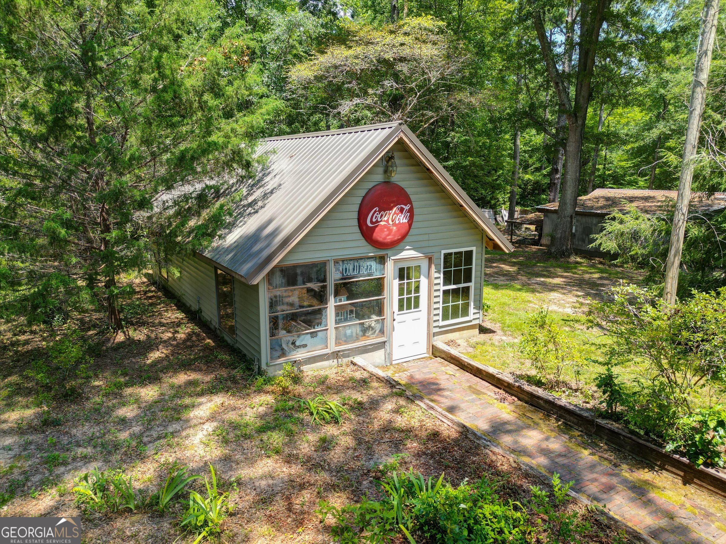 424 Hampton Road Hampton, GA 30228 - Photo 69 of 96 a view of an house with backyard space and balcony