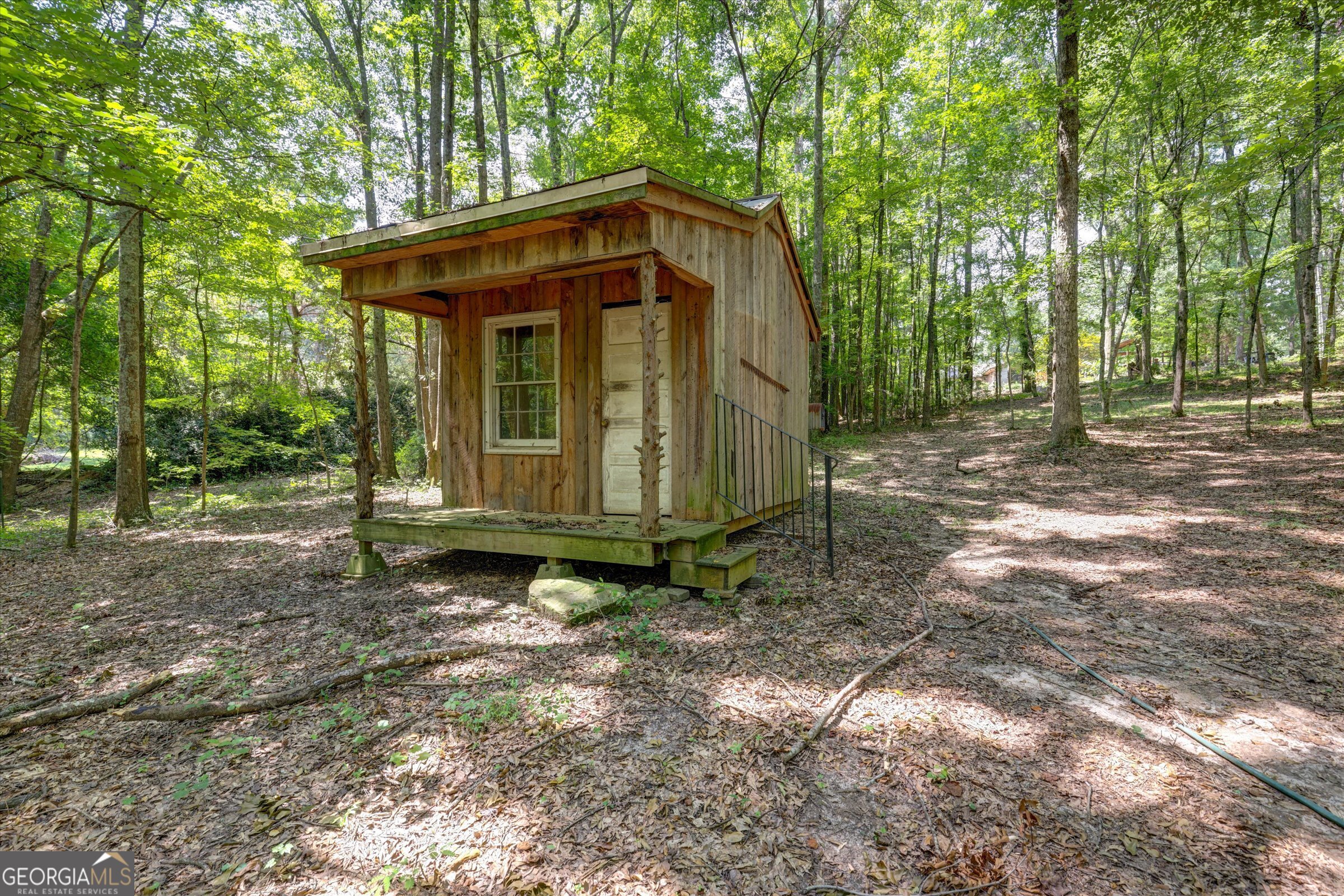 424 Hampton Road Hampton, GA 30228 - Photo 76 of 96 a view of a small house with a yard