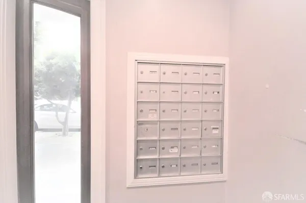 a view of a small space with wooden floor