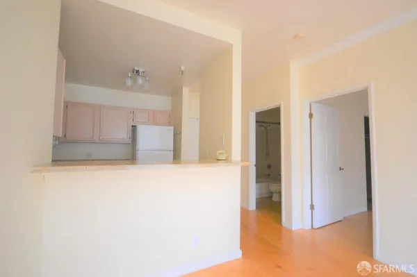 a kitchen with stainless steel appliances granite countertop a stove and a refrigerator