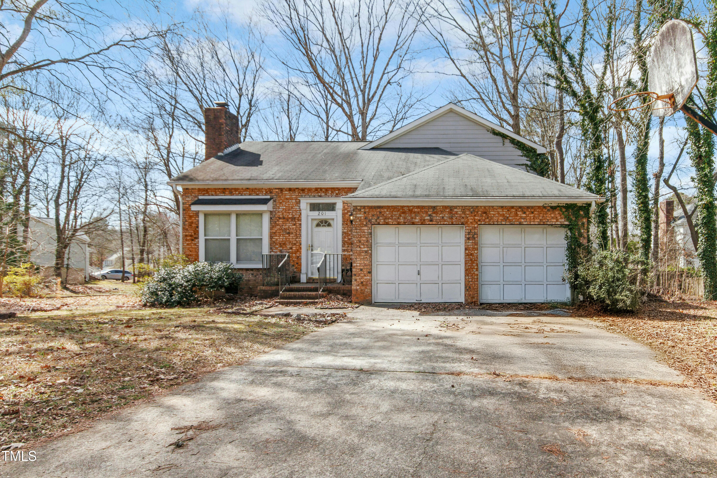 201 North Knightsbridge Road Cary, NC 27513 - Photo 1 of 7 a front view of a house with a yard