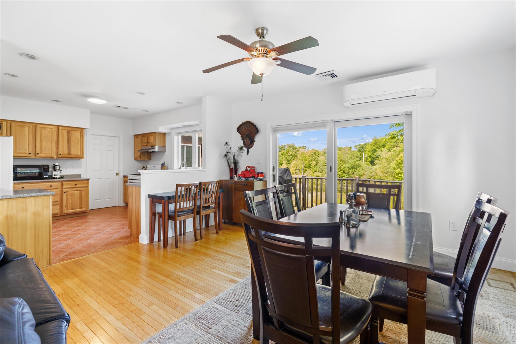 508 Woodstock Road Millbrook, NY 12545 - Photo 12 of 46 a view of a dining room with furniture window and wooden floor