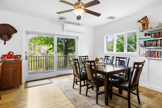 a view of a dining room with furniture window and outside view