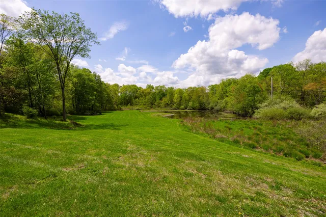 a view of a lake with a yard