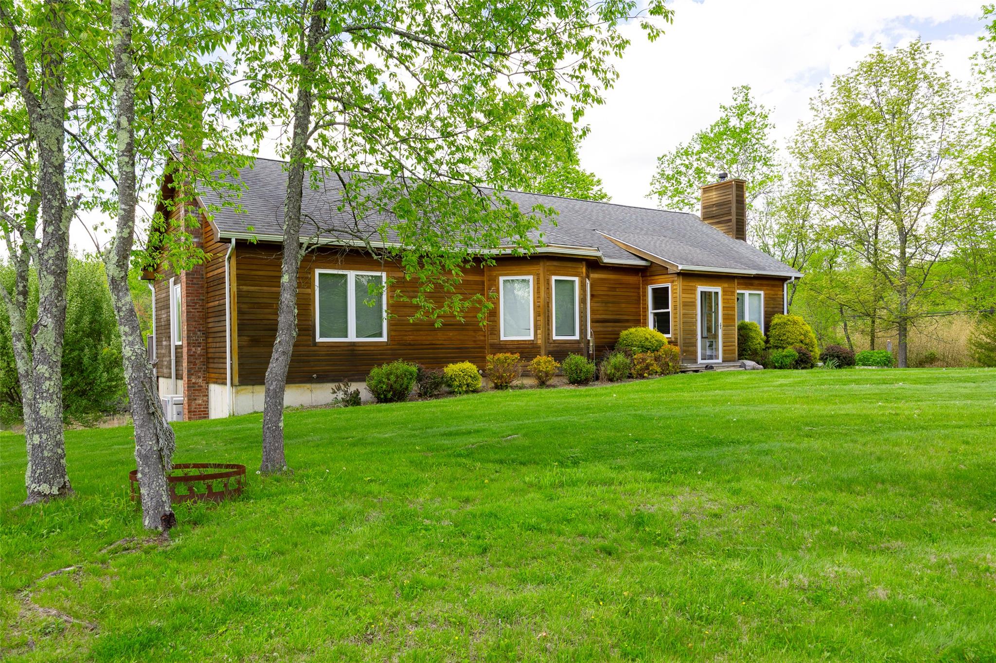 508 Woodstock Road Millbrook, NY 12545 - Photo 32 of 46 a front view of a house with a garden