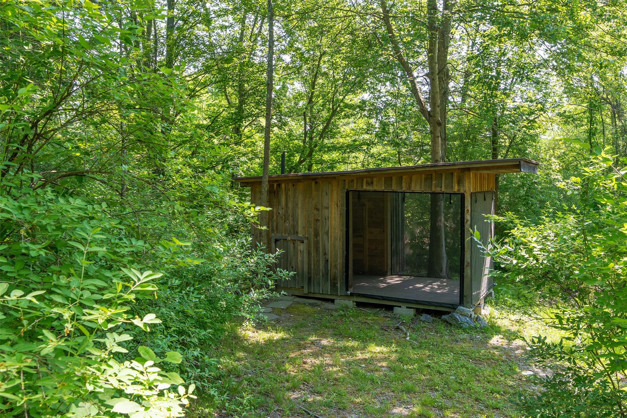 508 Woodstock Road Millbrook, NY 12545 - Photo 37 of 46 a view of house with backyard and garden