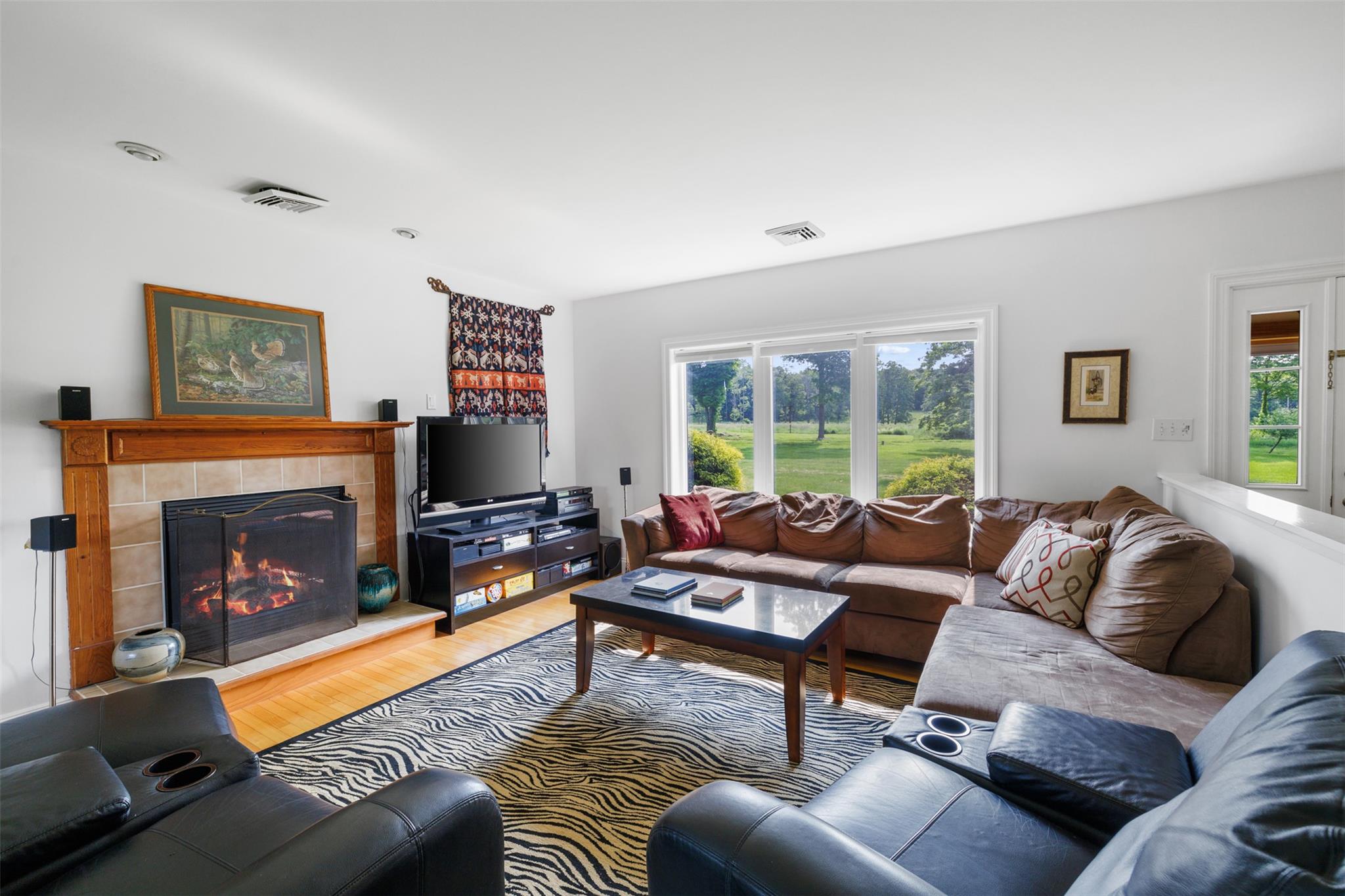 508 Woodstock Road Millbrook, NY 12545 - Photo 8 of 46 a living room with furniture and a fireplace