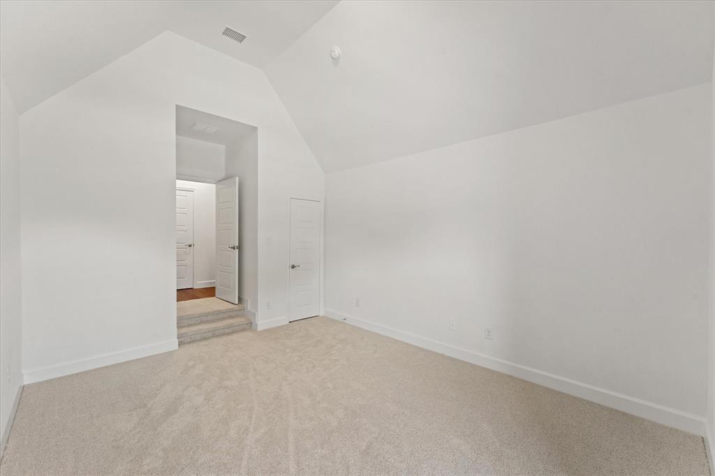 4626 Rillstone Road Midlothian, TX 76065 - Photo 31 of 40 Bonus room with light colored carpet and high vaulted ceiling