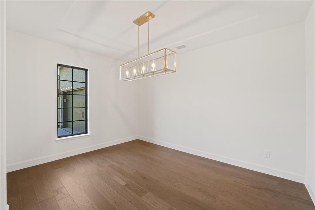 4626 Rillstone Road Midlothian, TX 76065 - Photo 4 of 40 Spare room with dark wood-style flooring and baseboards