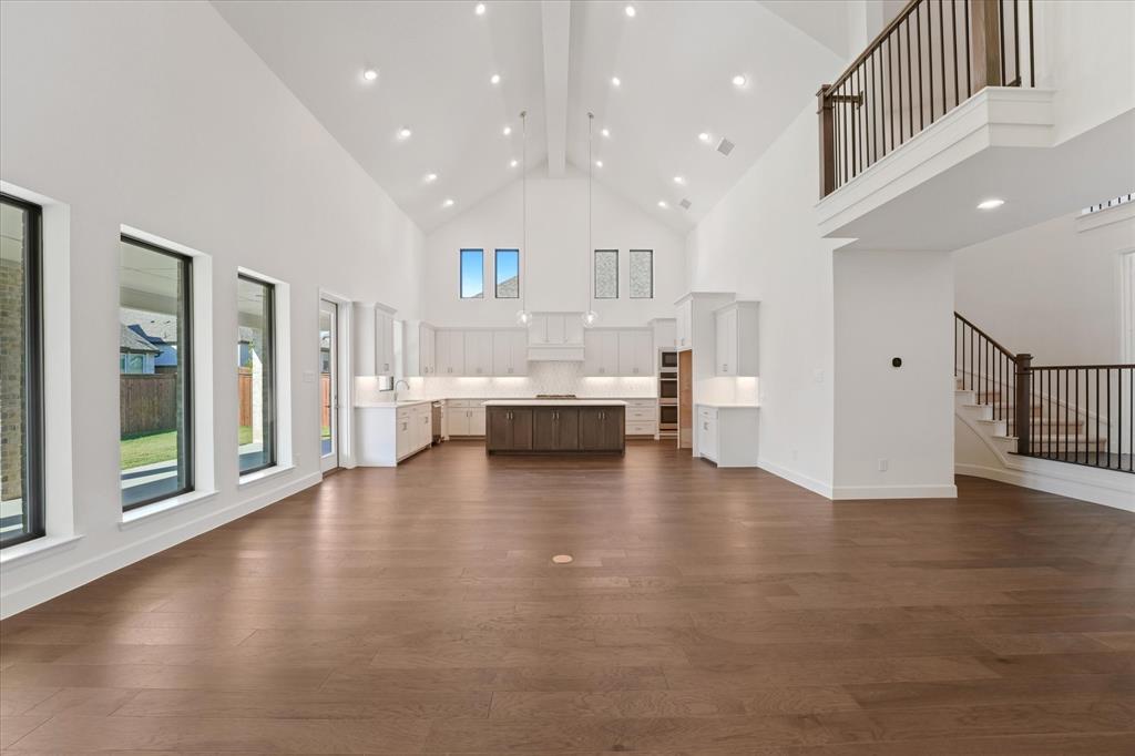 4626 Rillstone Road Midlothian, TX 76065 - Photo 7 of 40 Unfurnished living room with dark wood-type flooring, high vaulted ceiling, beamed ceiling, and recessed lighting