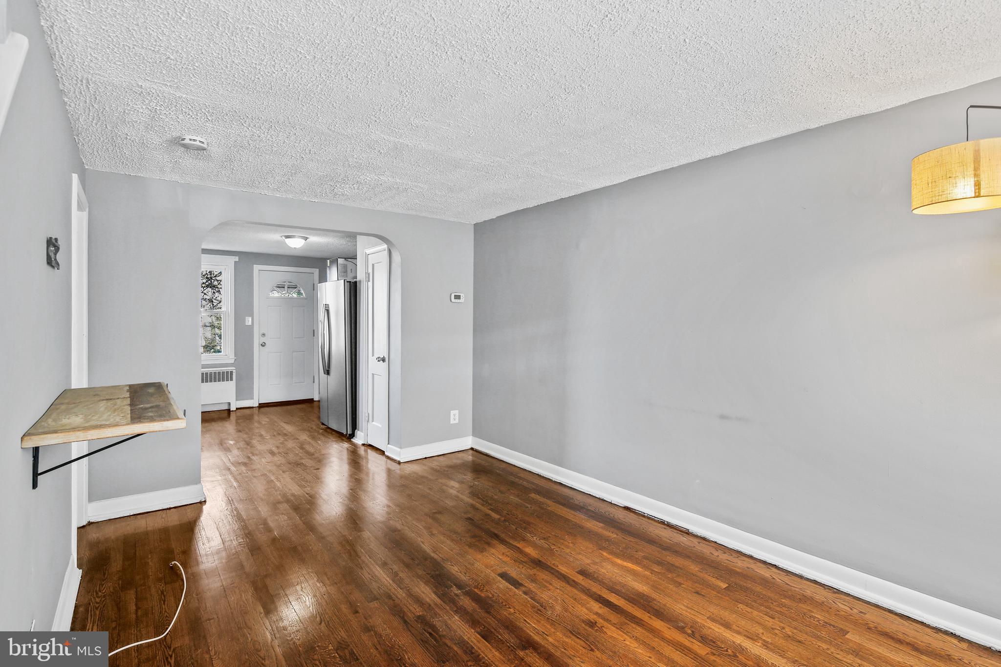 3606 Clarenell Road Baltimore, MD 21229 - Photo 5 of 26 Living Room w/Interior Arched Opening to Kitchen