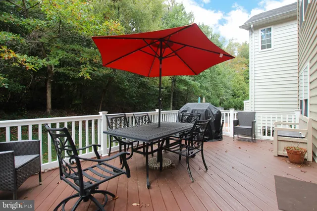 a view of a chairs and table on the deck
