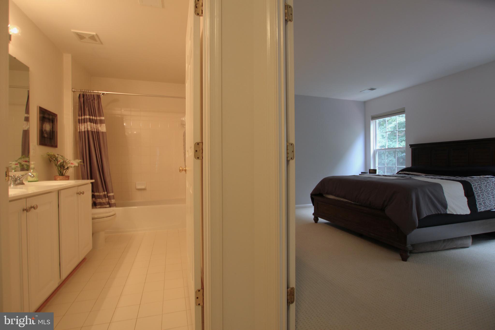 8532 Barrow Furnace Lane Lorton, VA 22079 - Photo 22 of 33 a bedroom with a bed and a couch