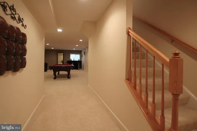 a view of kitchen with furniture and staircase