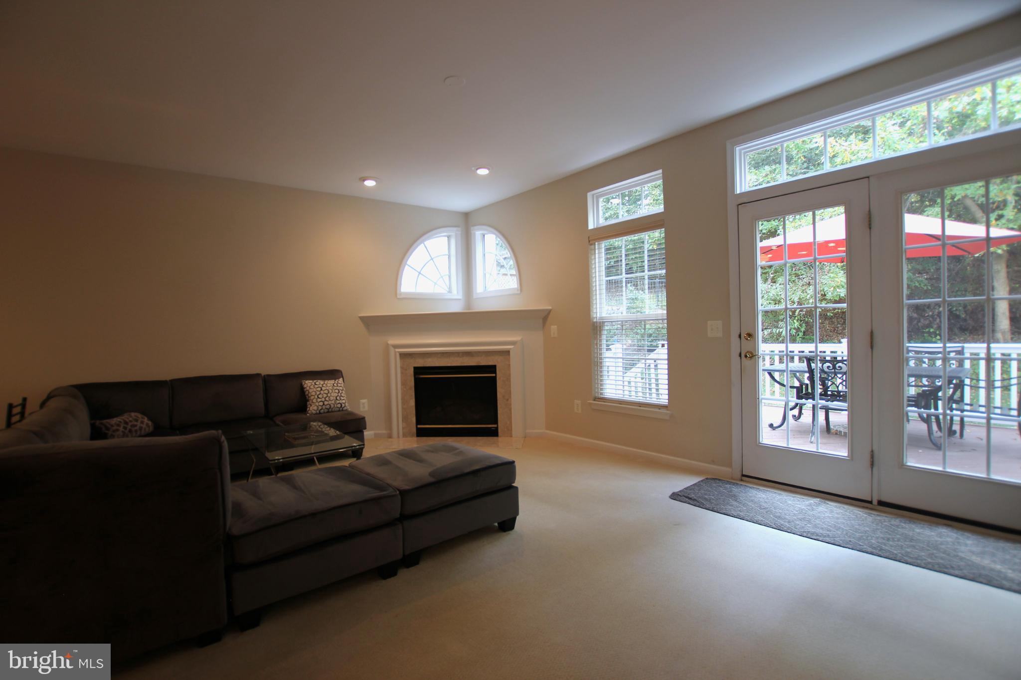 8532 Barrow Furnace Lane Lorton, VA 22079 - Photo 7 of 33 a living room with furniture and a fireplace