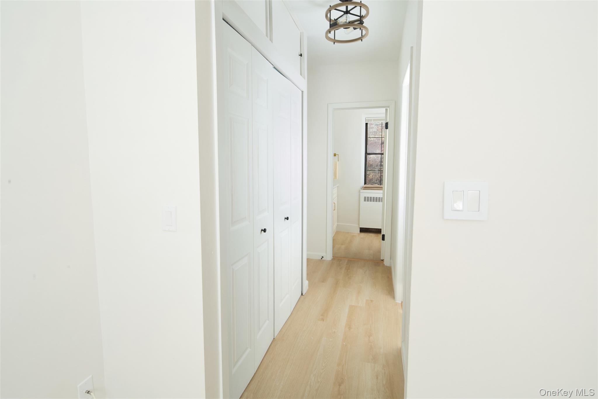 341 Furnace Dock Road, Unit 35 Cortlandt Manor, NY 10567 - Photo 13 of 25 a view of a hallway with wooden floor