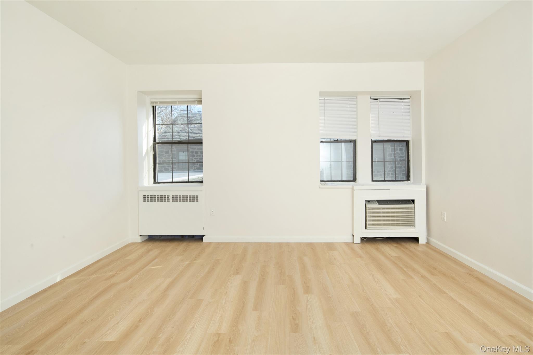 341 Furnace Dock Road, Unit 35 Cortlandt Manor, NY 10567 - Photo 14 of 25 an empty room with windows and cabinet