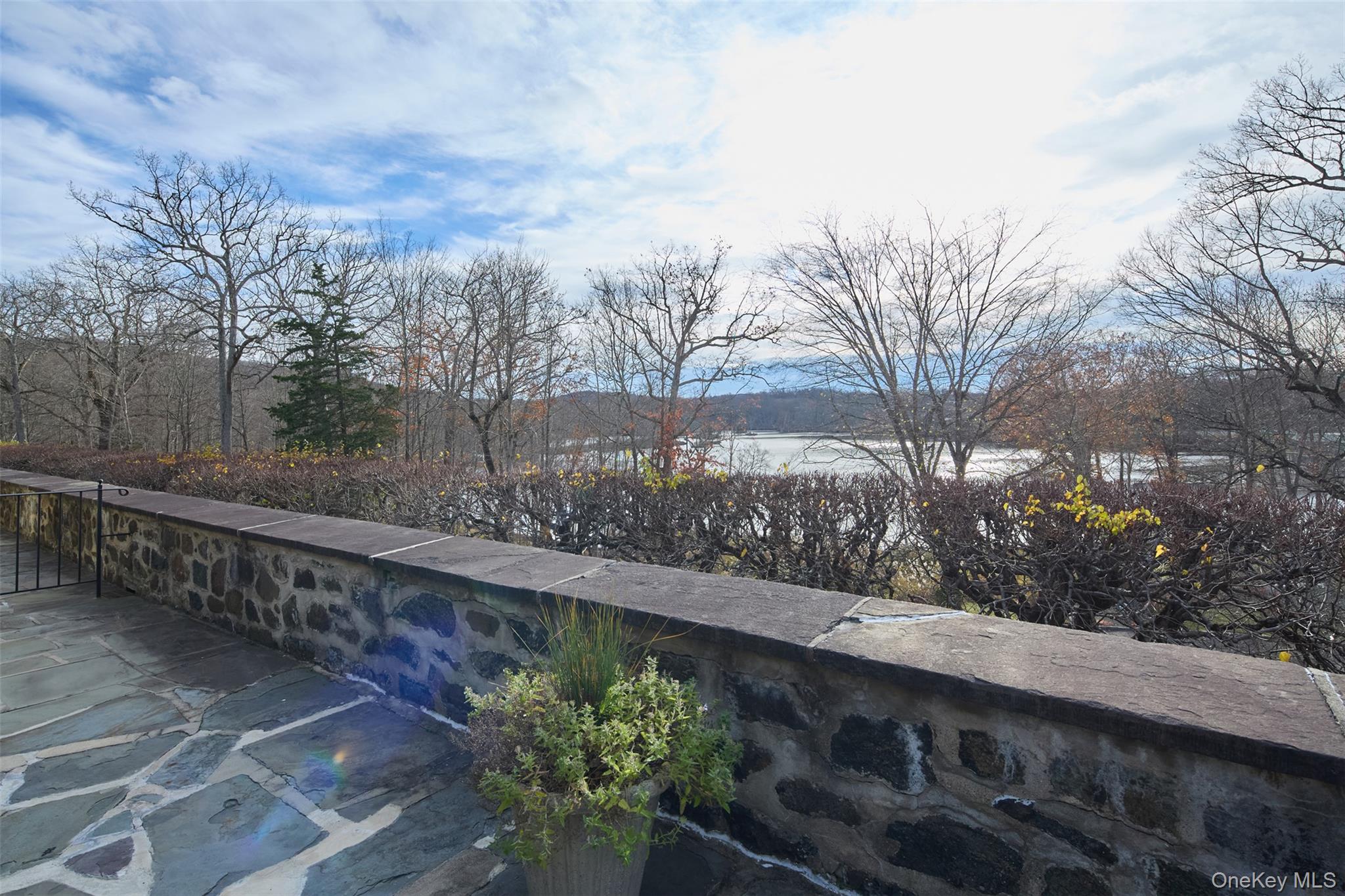 341 Furnace Dock Road, Unit 35 Cortlandt Manor, NY 10567 - Photo 19 of 25 a view of a pathway with a wrought fence