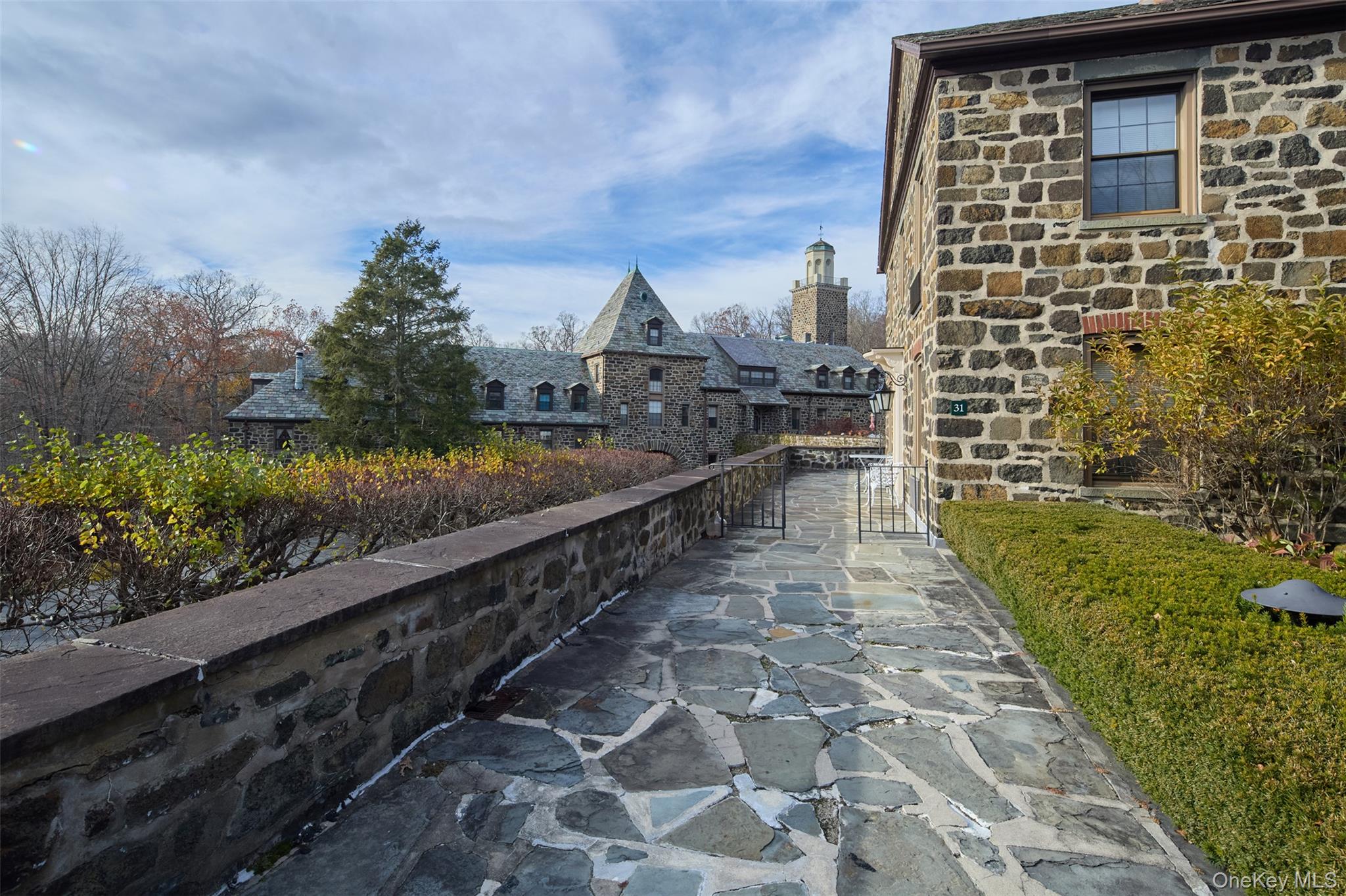 341 Furnace Dock Road, Unit 35 Cortlandt Manor, NY 10567 - Photo 20 of 25 a view of a pathway both side of building