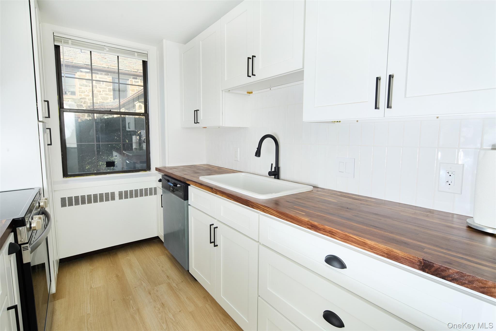 341 Furnace Dock Road, Unit 35 Cortlandt Manor, NY 10567 - Photo 2 of 25 a bathroom with a sink and a mirror