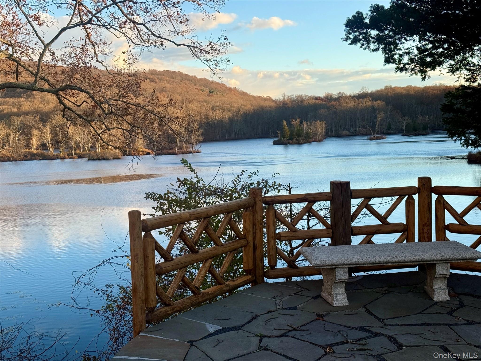 341 Furnace Dock Road, Unit 35 Cortlandt Manor, NY 10567 - Photo 24 of 25 a view of a chairs and table on the terrace