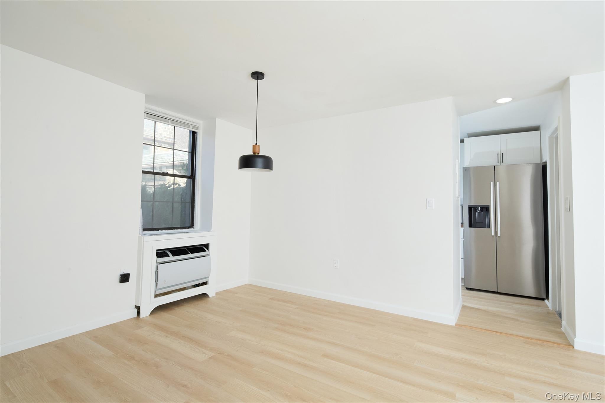 341 Furnace Dock Road, Unit 35 Cortlandt Manor, NY 10567 - Photo 6 of 25 a view of empty room with wooden floor