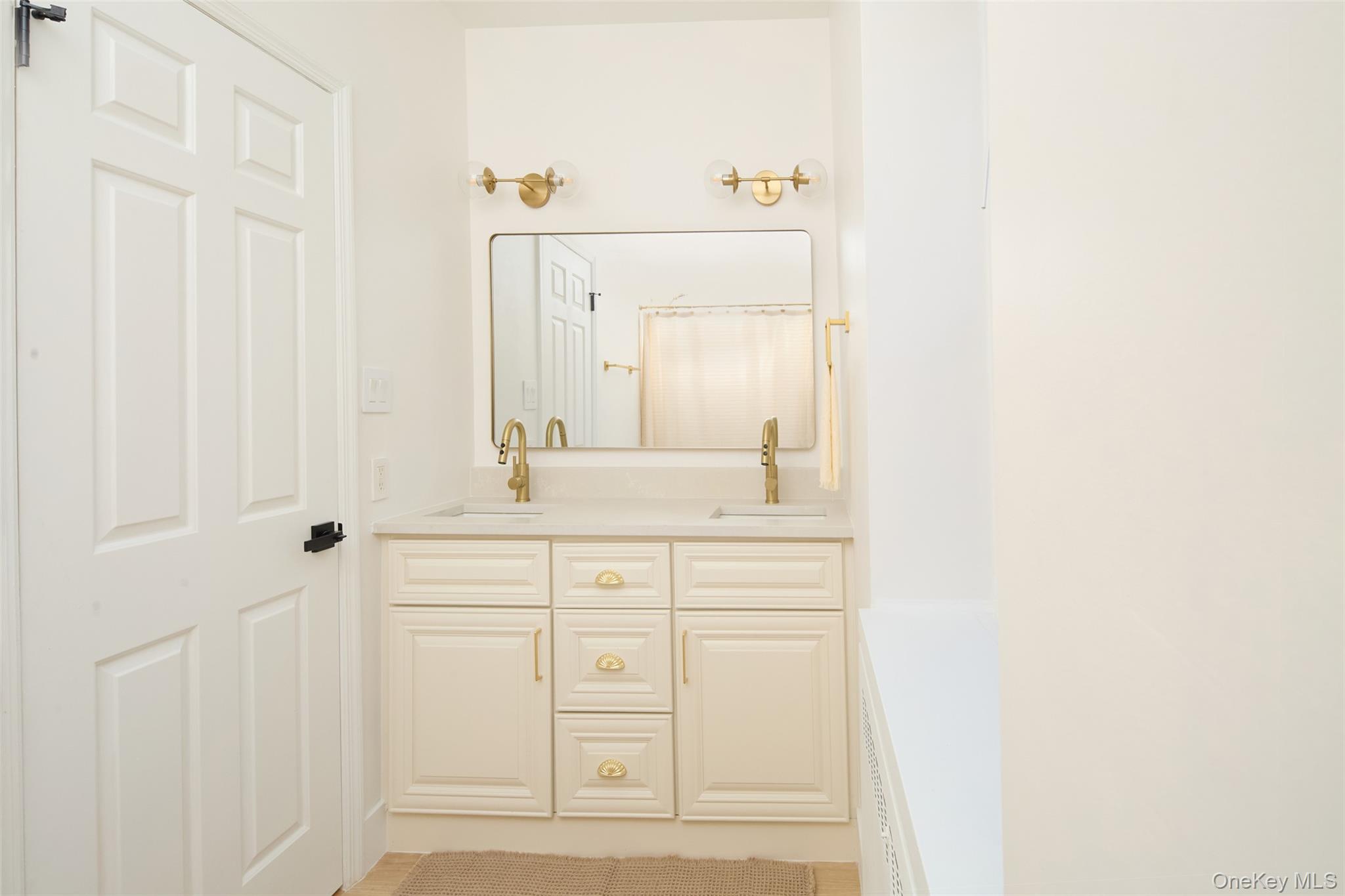 341 Furnace Dock Road, Unit 35 Cortlandt Manor, NY 10567 - Photo 10 of 25 a bathroom with a sink and a mirror