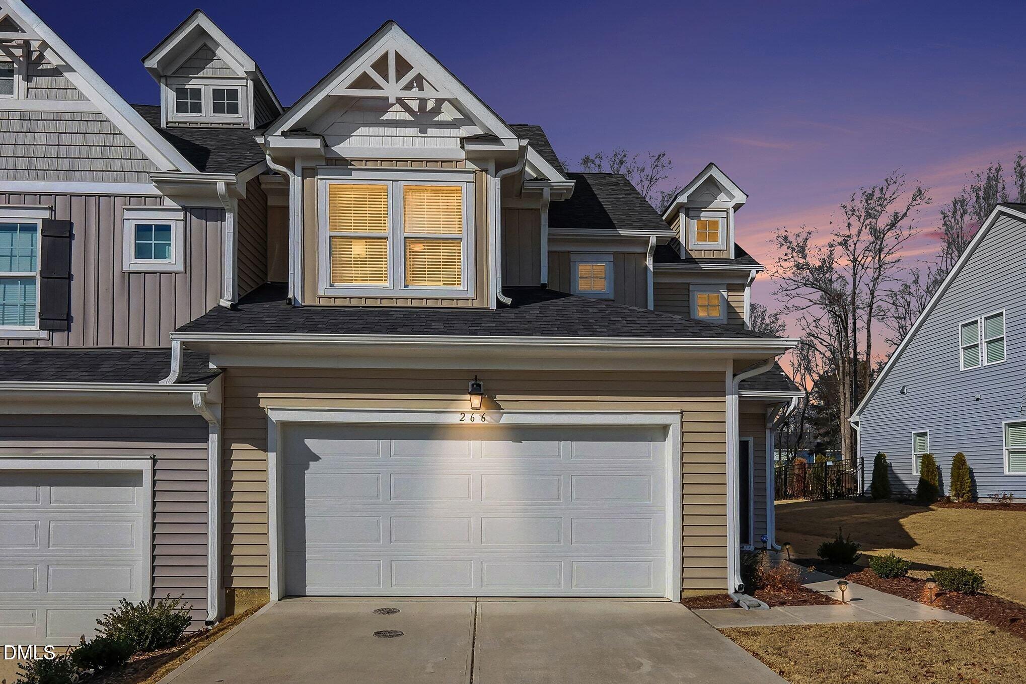 266 Shingle Oak Road Wake Forest, NC 27587 - Photo 1 of 36 a front view of a house with a yard