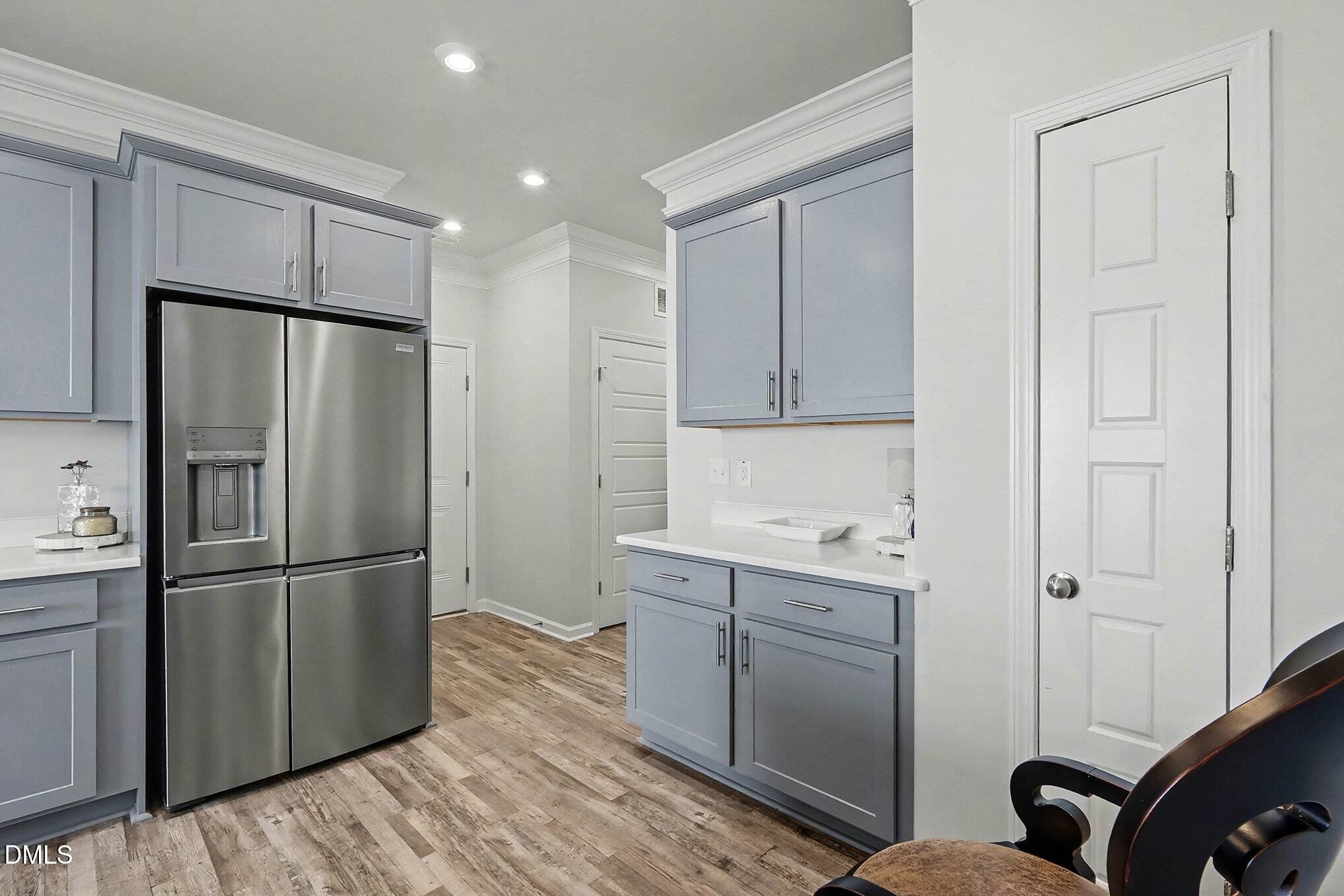 266 Shingle Oak Road Wake Forest, NC 27587 - Photo 11 of 36 a kitchen with a refrigerator sink and cabinets