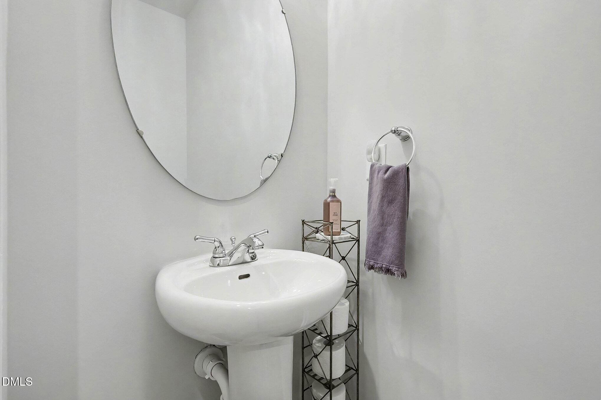 266 Shingle Oak Road Wake Forest, NC 27587 - Photo 16 of 36 a bathroom with a sink and a mirror