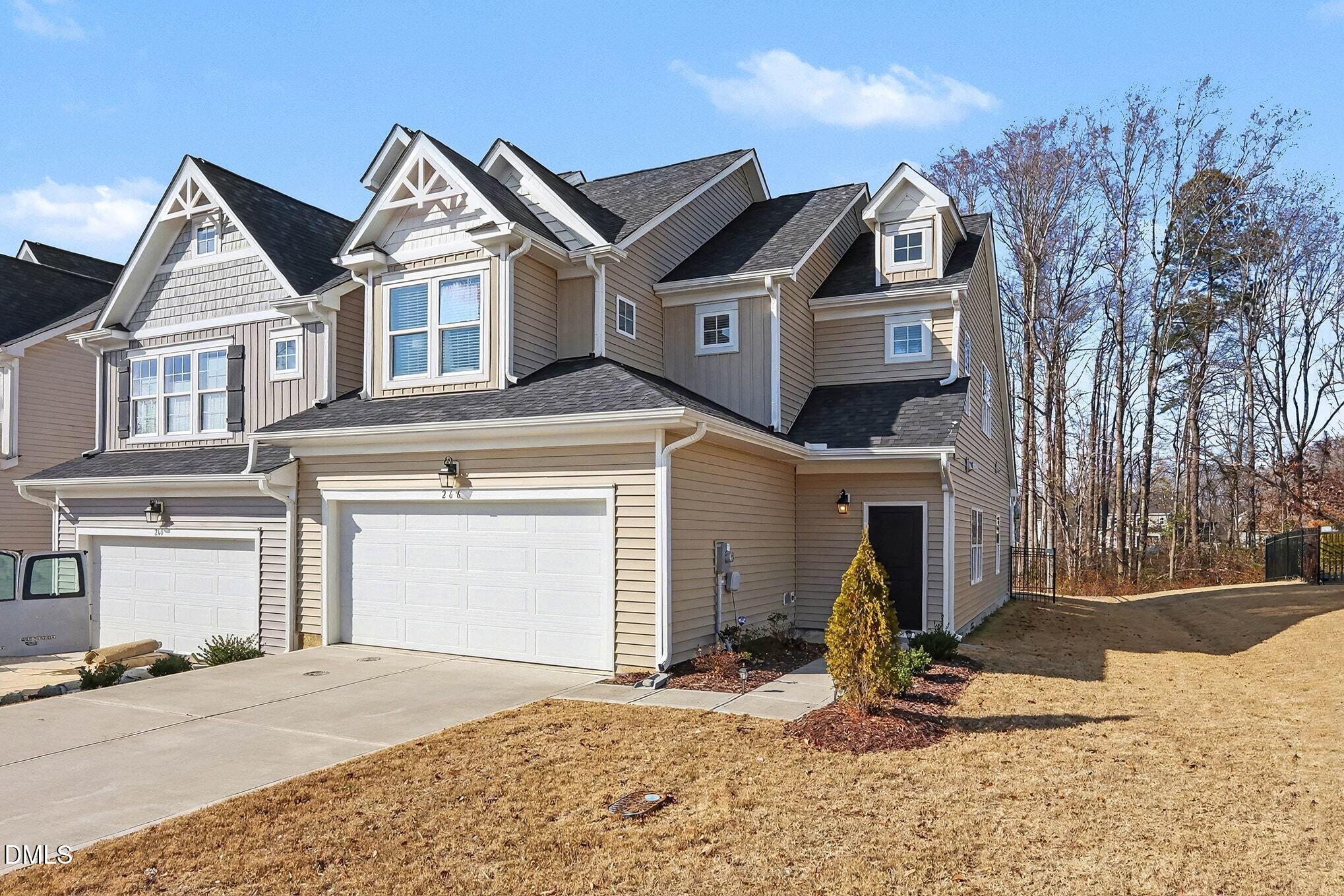 266 Shingle Oak Road Wake Forest, NC 27587 - Photo 2 of 36 a front view of a house with garden