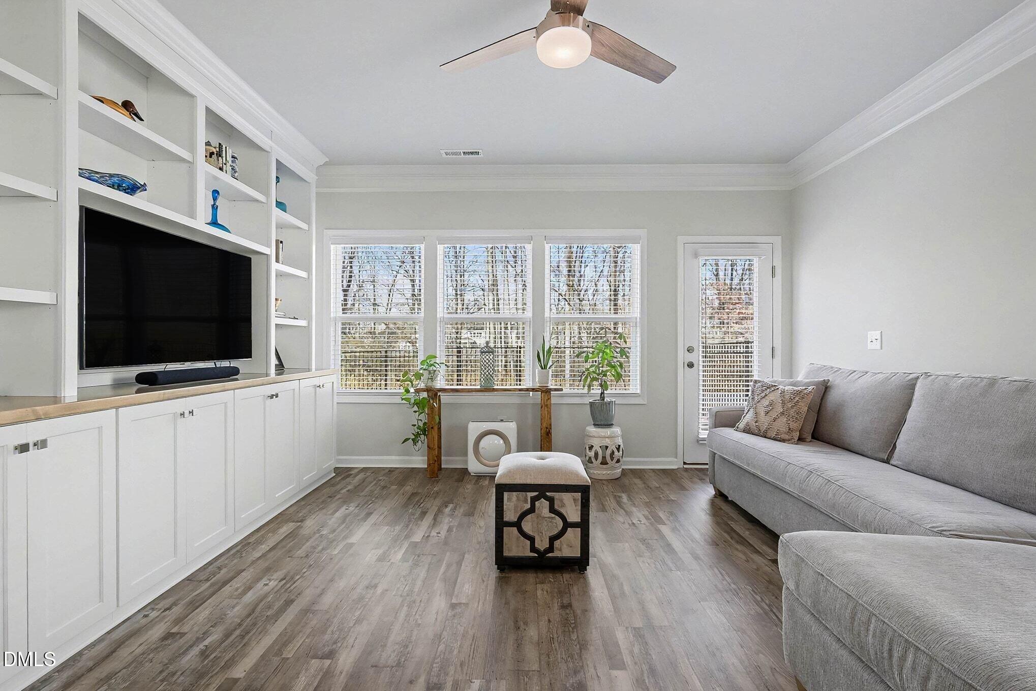 266 Shingle Oak Road Wake Forest, NC 27587 - Photo 3 of 36 a living room with furniture and a flat screen tv