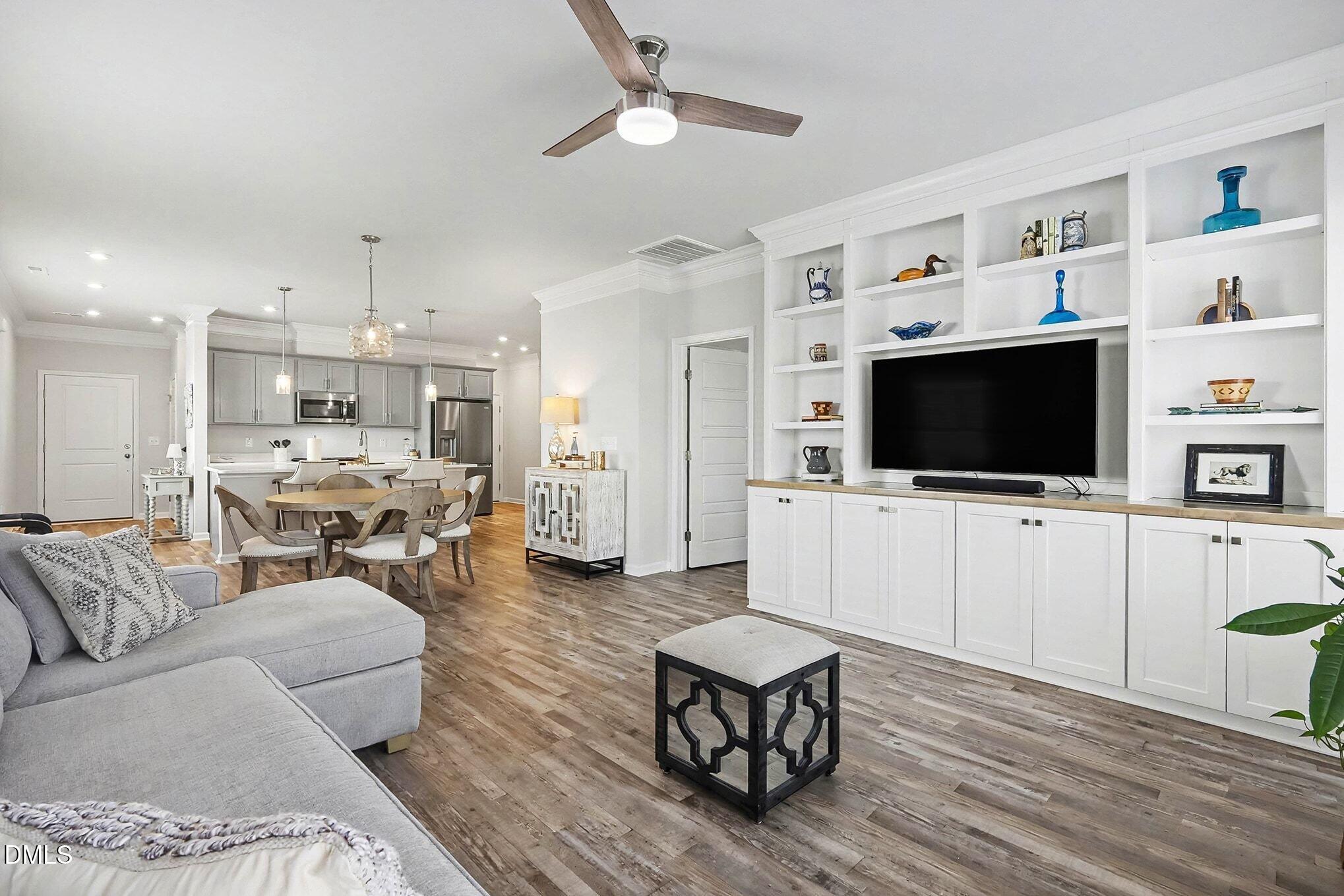 266 Shingle Oak Road Wake Forest, NC 27587 - Photo 6 of 36 a living room with furniture and a flat screen tv