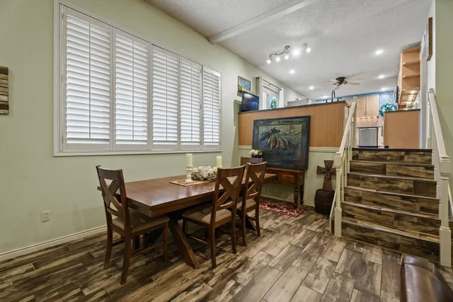 a dining room with furniture and window