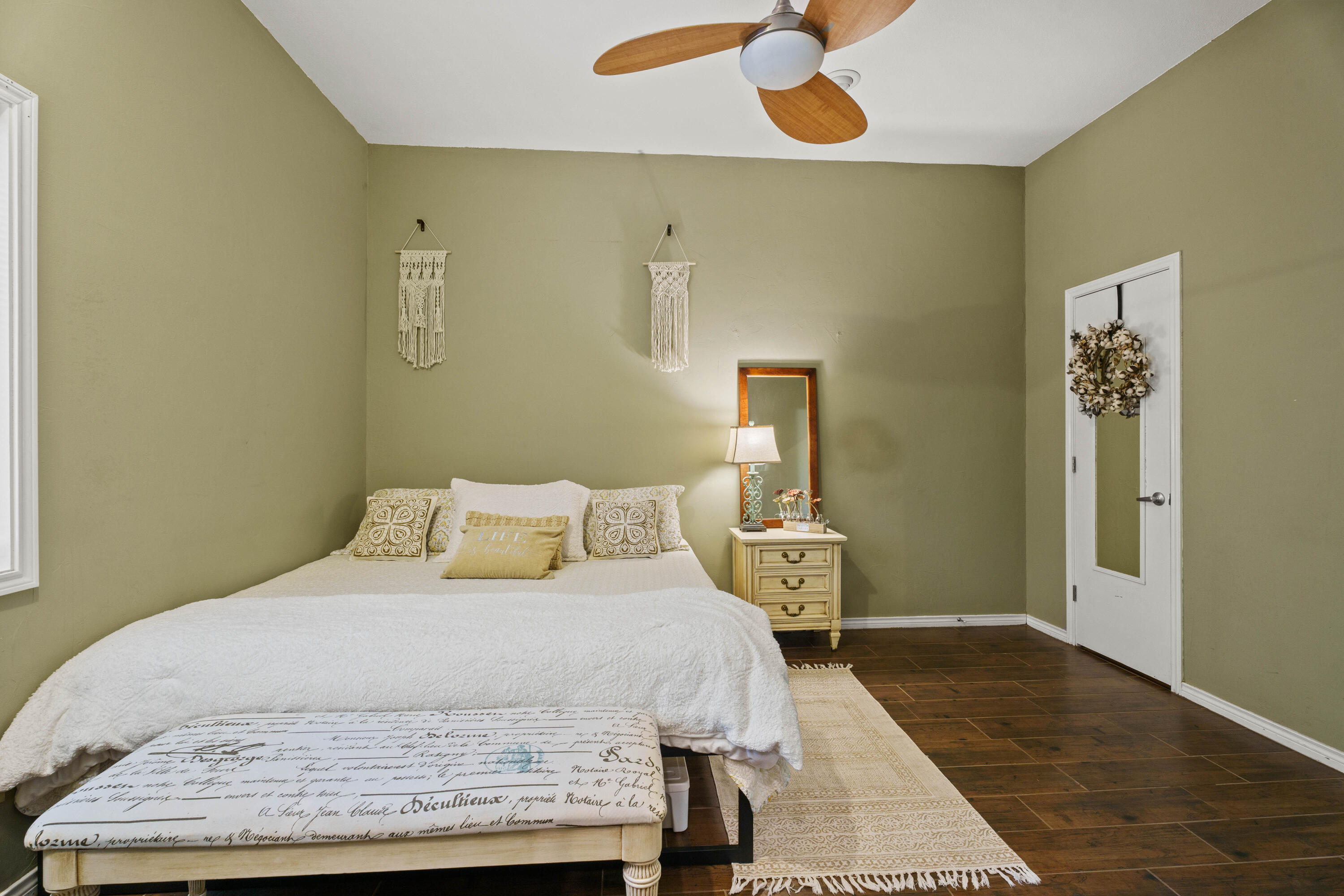 47 South Lake Shore Drive Ransom Canyon, TX 79366 - Photo 23 of 33 a bedroom with a bed and wooden floor