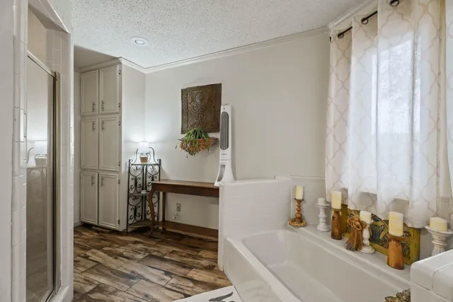 a bathroom with a tub and a sink