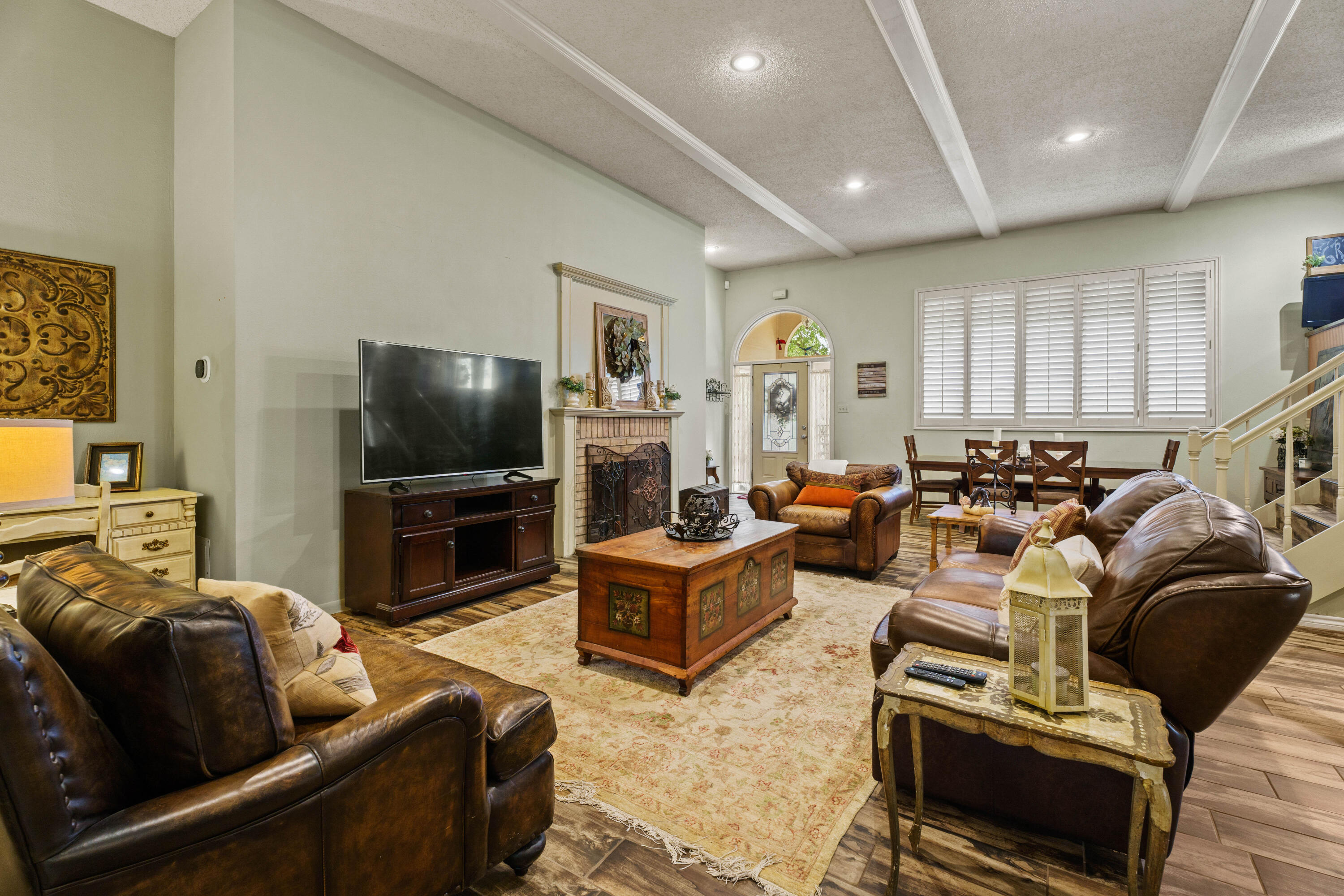 47 South Lake Shore Drive Ransom Canyon, TX 79366 - Photo 10 of 33 a living room with furniture a flat screen tv and a window