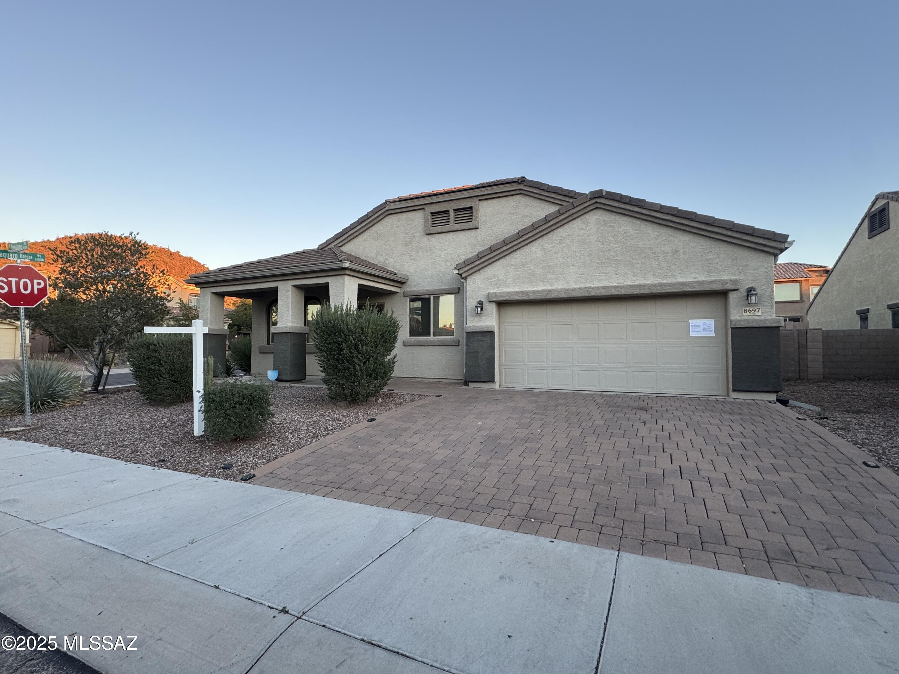 8697 West Denstone Road Marana, AZ 85653 - Photo 4 of 21 Brick driveway just make the home extra inviting.