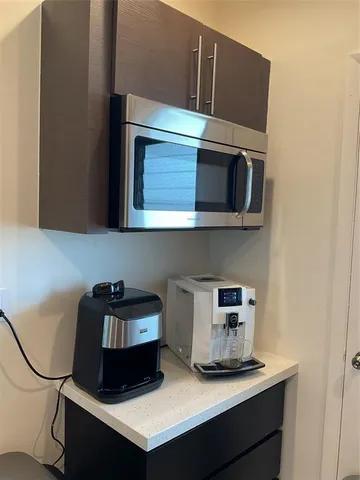 a kitchen with a stove and a microwave