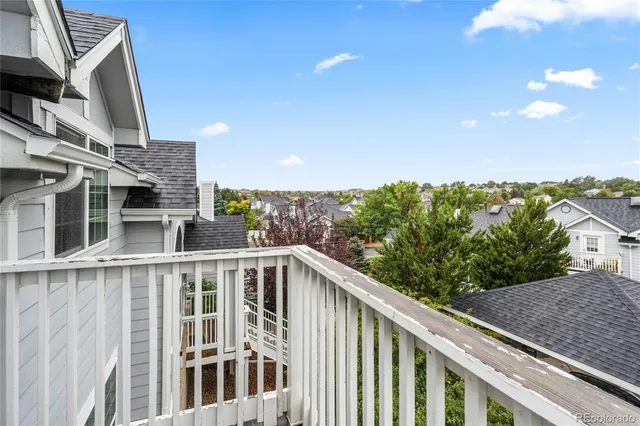 a view of balcony with furniture