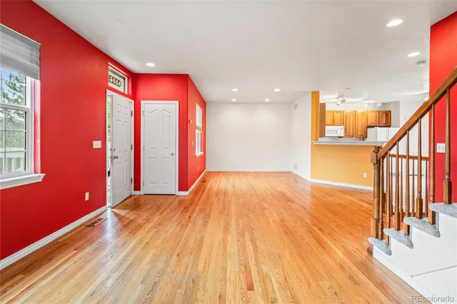 a view of an empty room with stairs