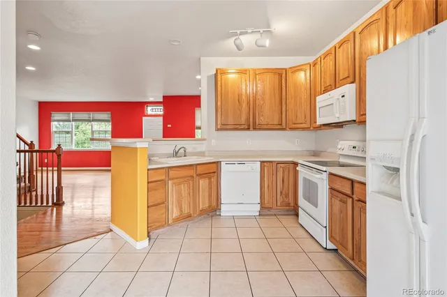 a kitchen with stainless steel appliances a stove sink and cabinets