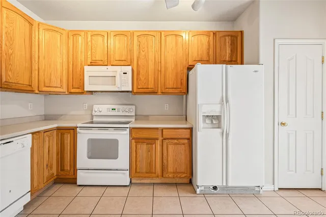 a kitchen with stainless steel appliances a refrigerator sink and cabinets