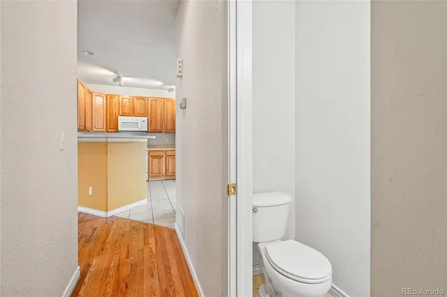 a bathroom with a toilet sink and vanity