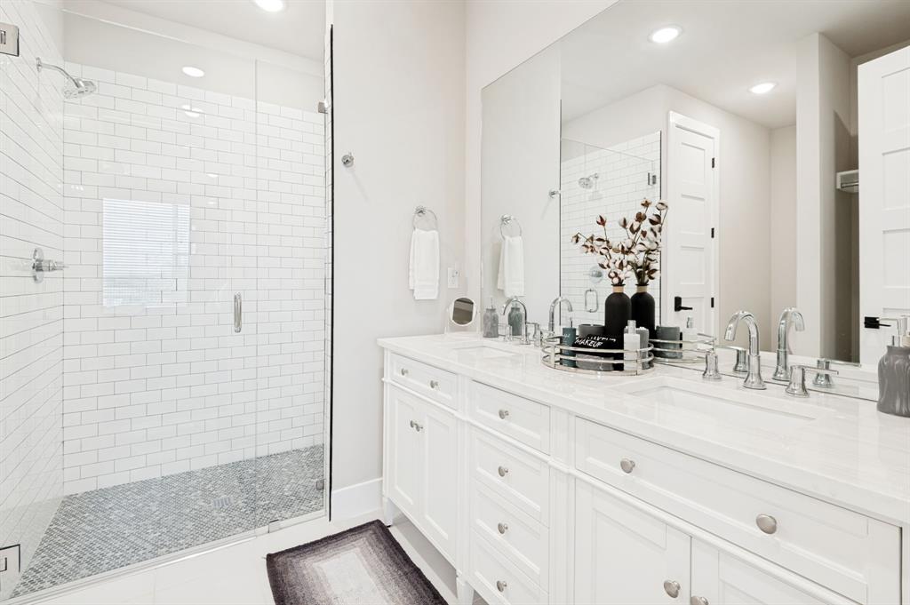3412 Scenic Point Road, Unit 102 Graford, TX 76449 - Photo 18 of 31 a bathroom with a shower sink and mirror